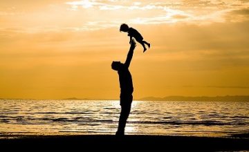 Father and son on the Beach - Silhouette Shot